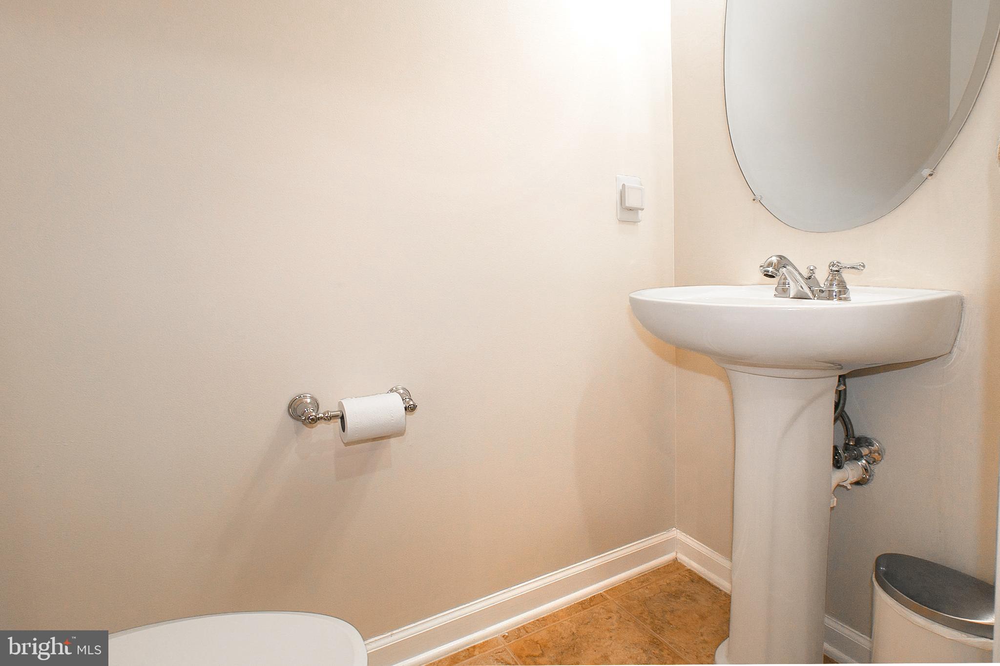 12426 Liberty Bridge Road Fairfax, VA 22033 - Photo 10 of 28 a bathroom with a sink and a mirror