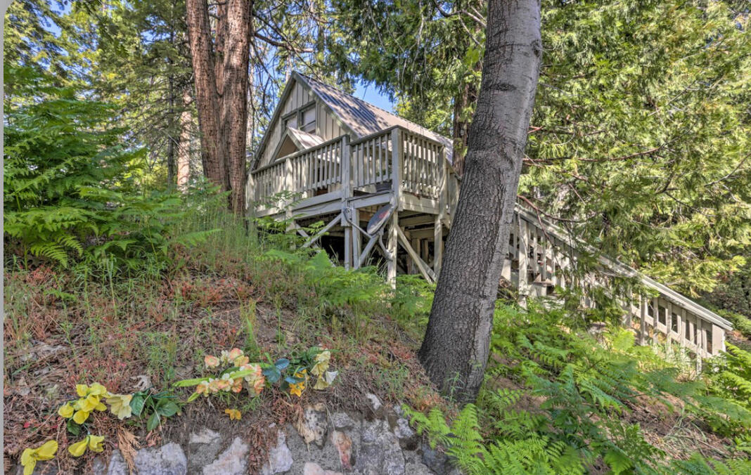 42036 Tollhouse Road Shaver Lake, CA 93664 - Photo 28 of 30 a view of a house with large trees and a yard