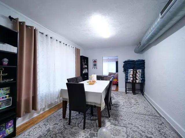 a bathroom with a sink mirror vanity and toilet