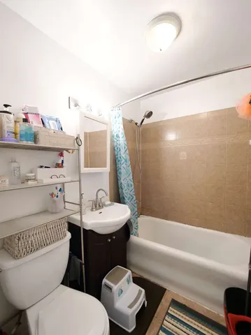 a bed room with a bed and a baby bed