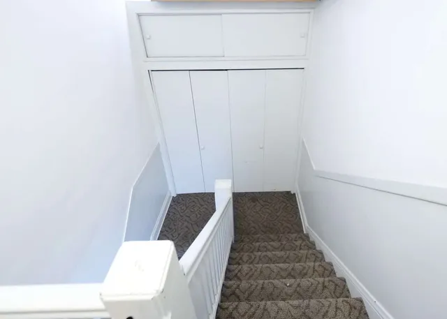 a view of roof deck with patio