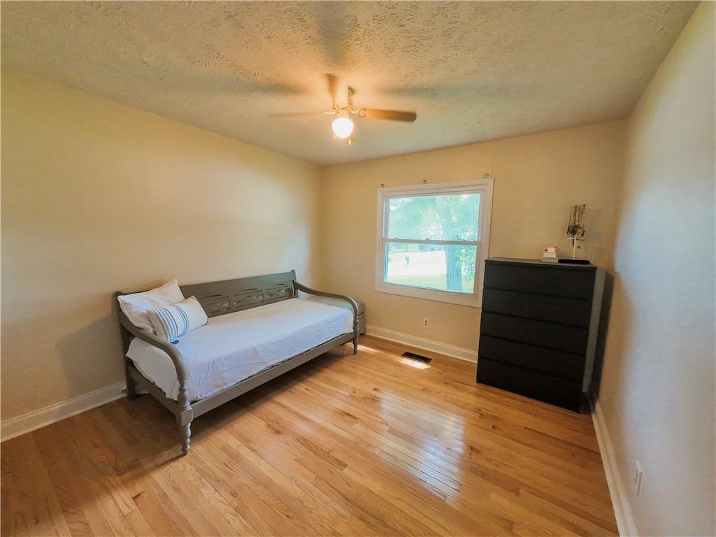 3905 Hunt Drive Gainesville, GA 30507 - Photo 12 of 16 a living room with a bed furniture and a window