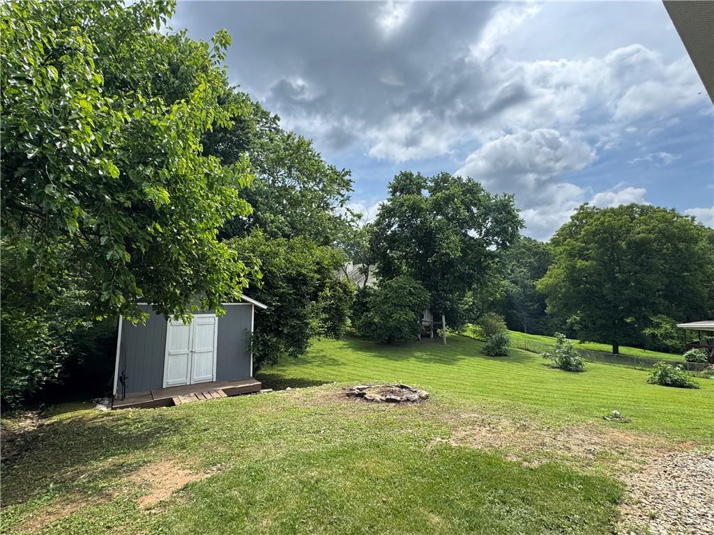 3905 Hunt Drive Gainesville, GA 30507 - Photo 3 of 16 a view of a backyard with large trees