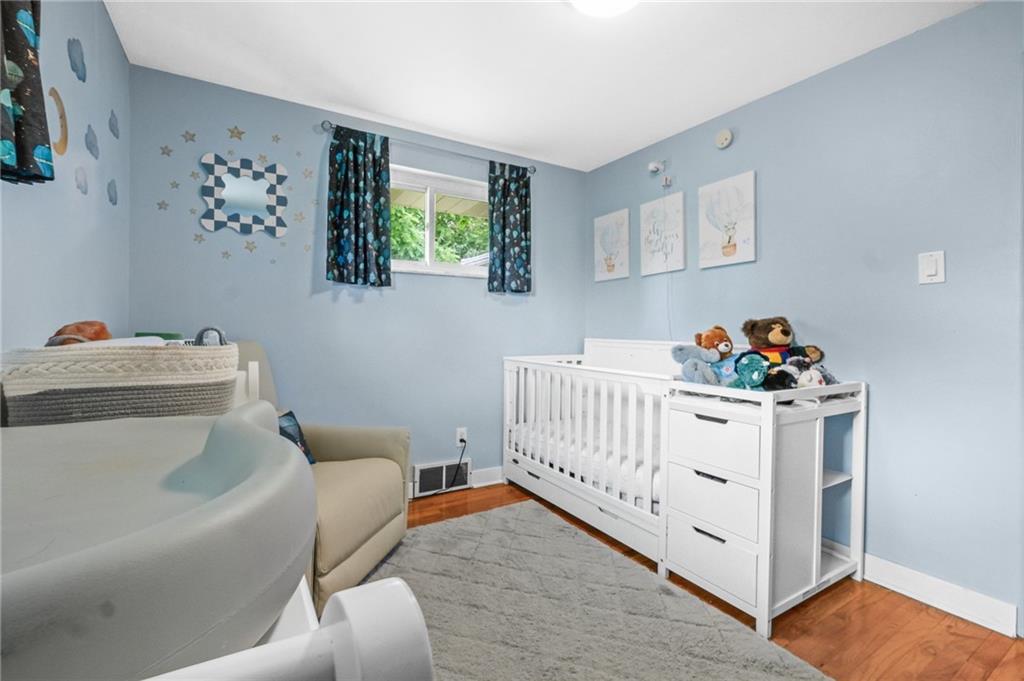 1654 Hollyrood Road Pittsburgh, PA 15227 - Photo 15 of 33 a bedroom with furniture and wooden floor