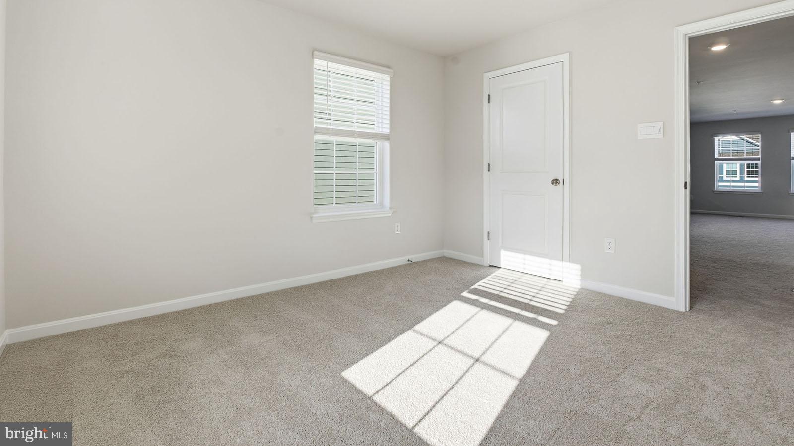 8110 Cypress Pt Drive Rosedale, MD 21237 - Photo 21 of 37 an empty room with windows