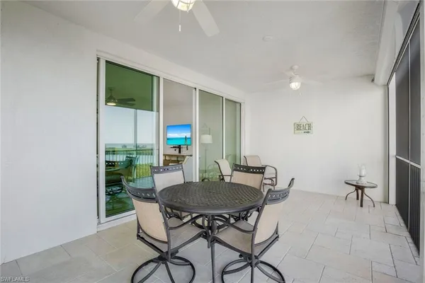 a view of a dining room with furniture and a potted plant