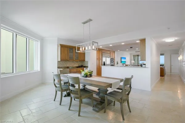 a view of a dining room with furniture and window