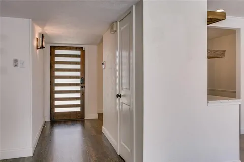 a view of a room with a white walls