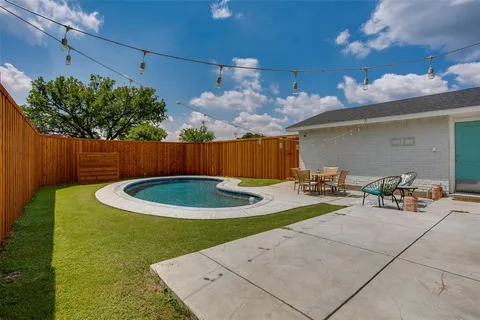 a view of a chairs and table in the patio