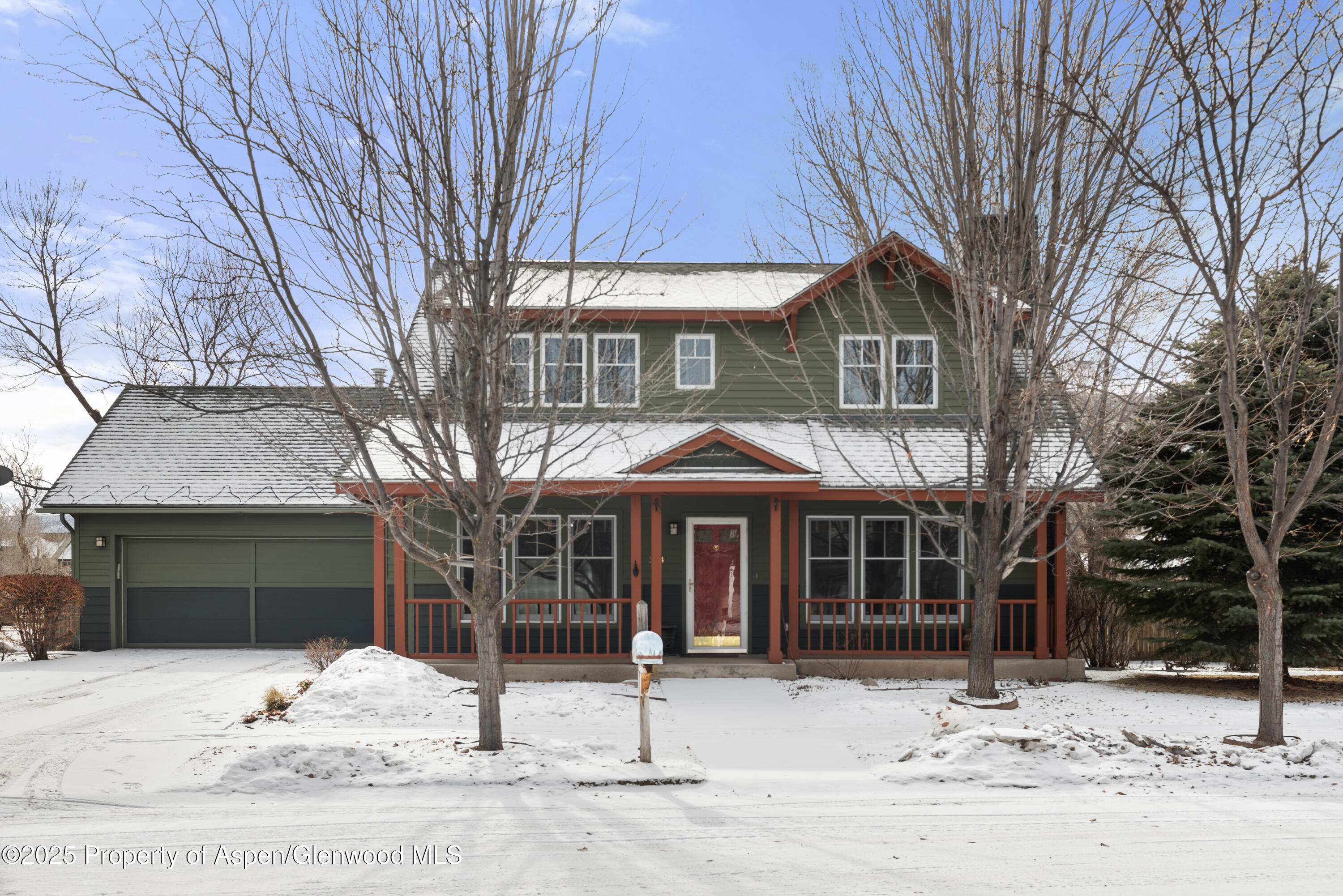 314 Sopris Circle Basalt, CO 81621 - Photo 1 of 36 a front view of a house with a yard and garage
