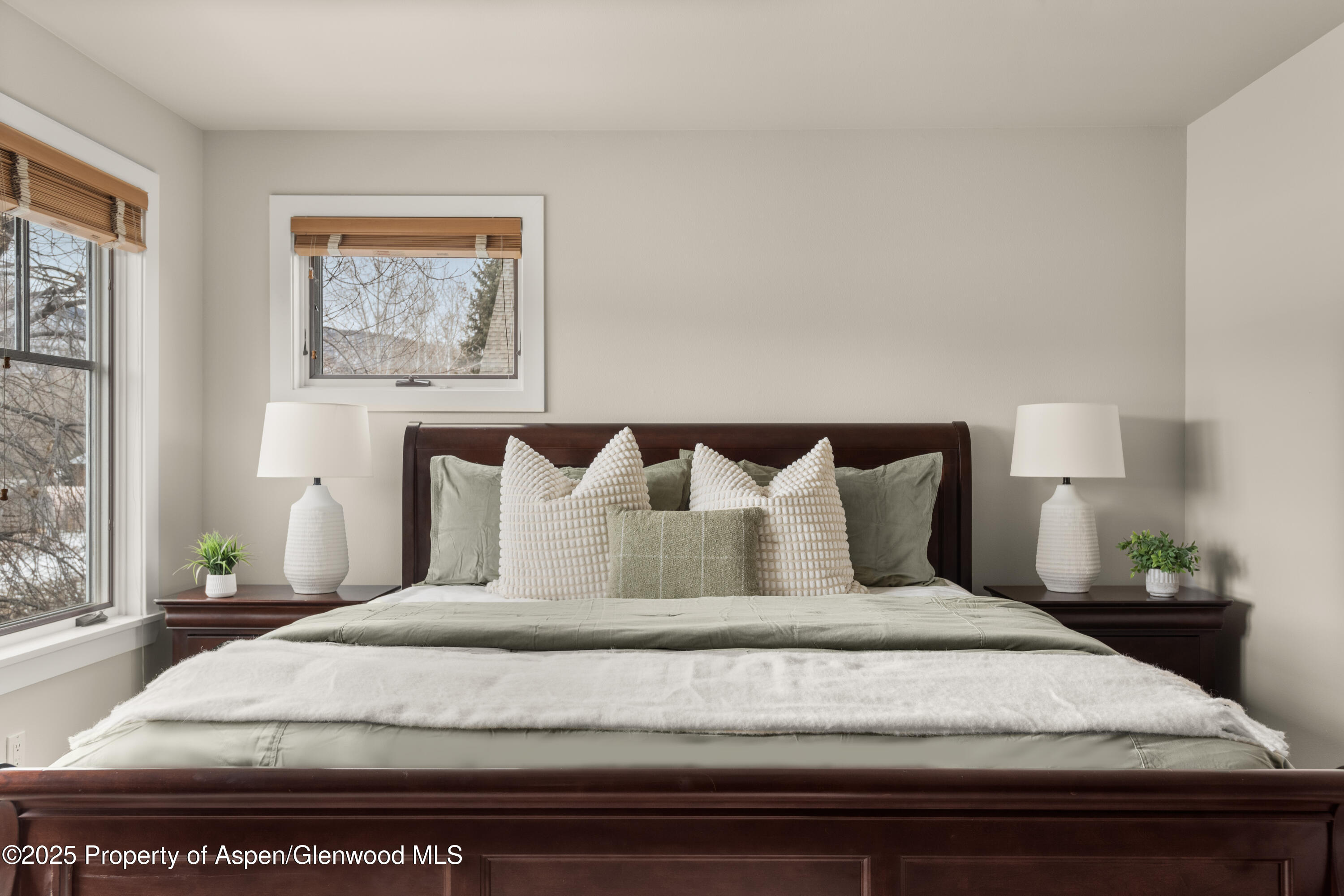 314 Sopris Circle Basalt, CO 81621 - Photo 16 of 36 a bedroom with a bed and painting on the wall