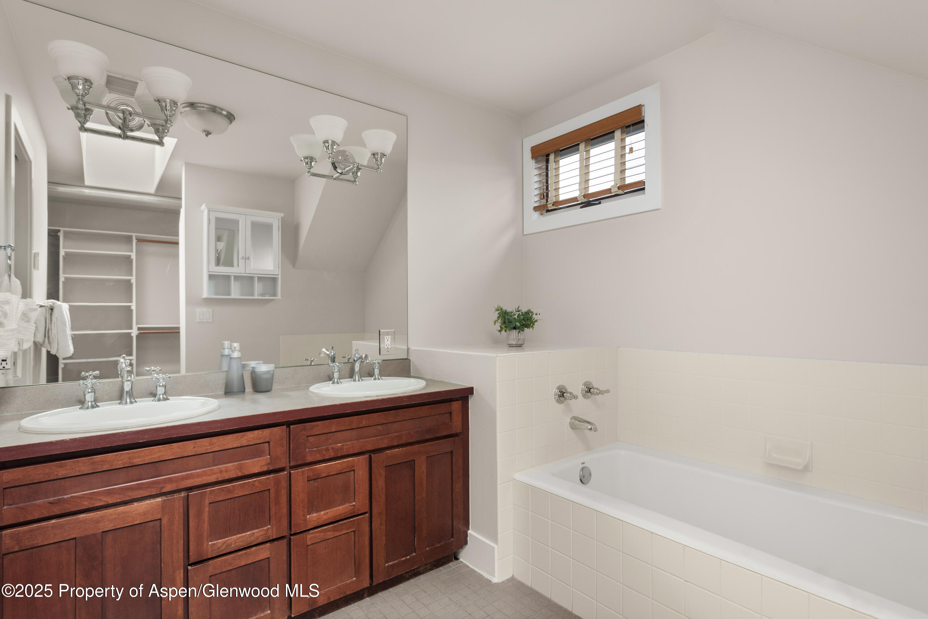 314 Sopris Circle Basalt, CO 81621 - Photo 19 of 36 a bathroom with a tub sink and mirror