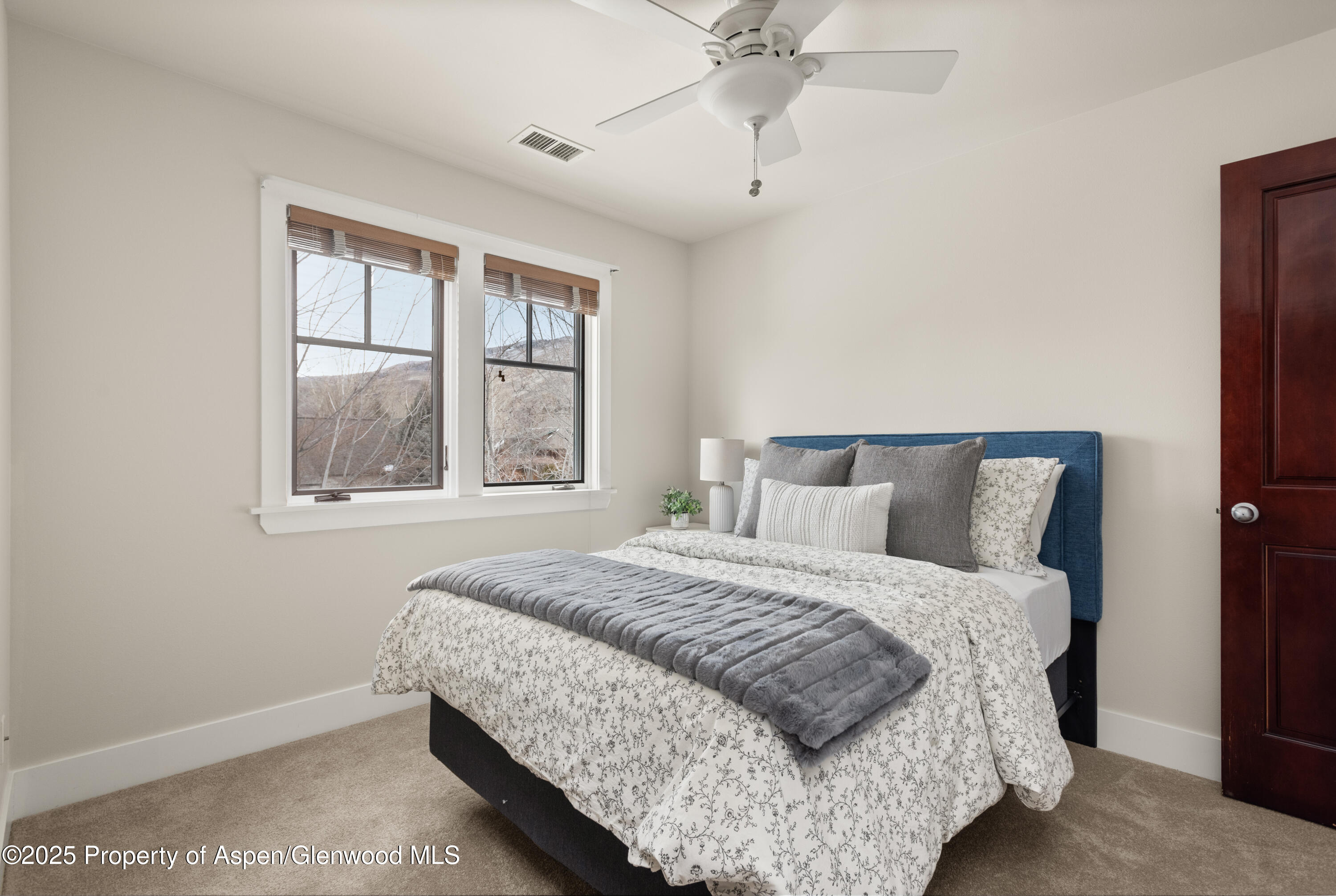 314 Sopris Circle Basalt, CO 81621 - Photo 23 of 36 a bedroom with a large bed and a window