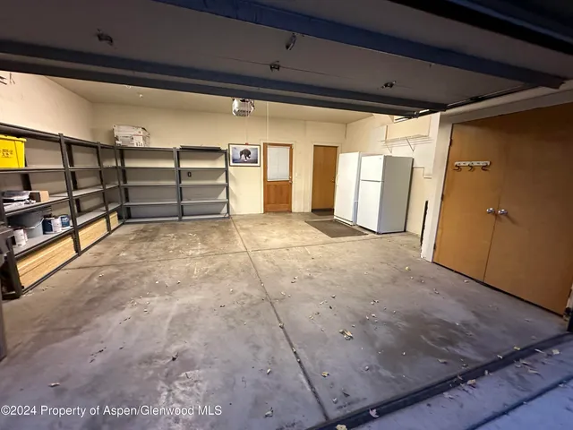 a view of an empty room with wooden roof