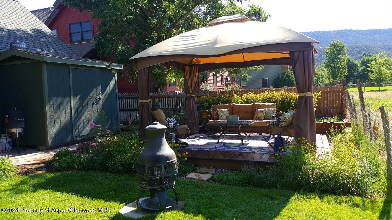 314 Sopris Circle Basalt, CO 81621 - Photo 28 of 36 a patio with table and chairs and potted plants