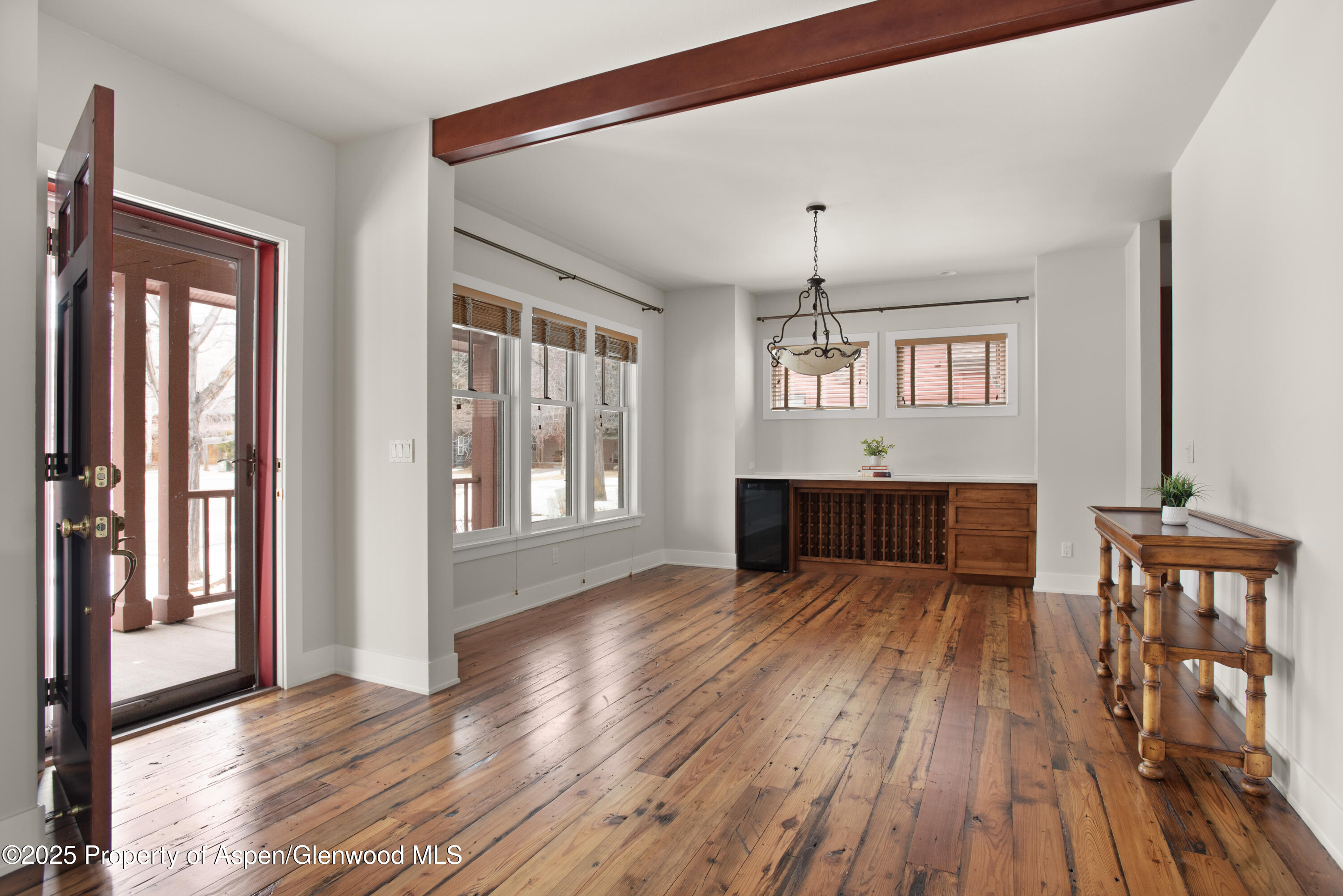 314 Sopris Circle Basalt, CO 81621 - Photo 3 of 36 a living room with wooden floors and dining table