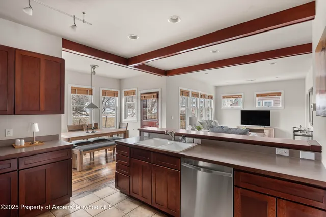 a kitchen with a sink stove and cabinets