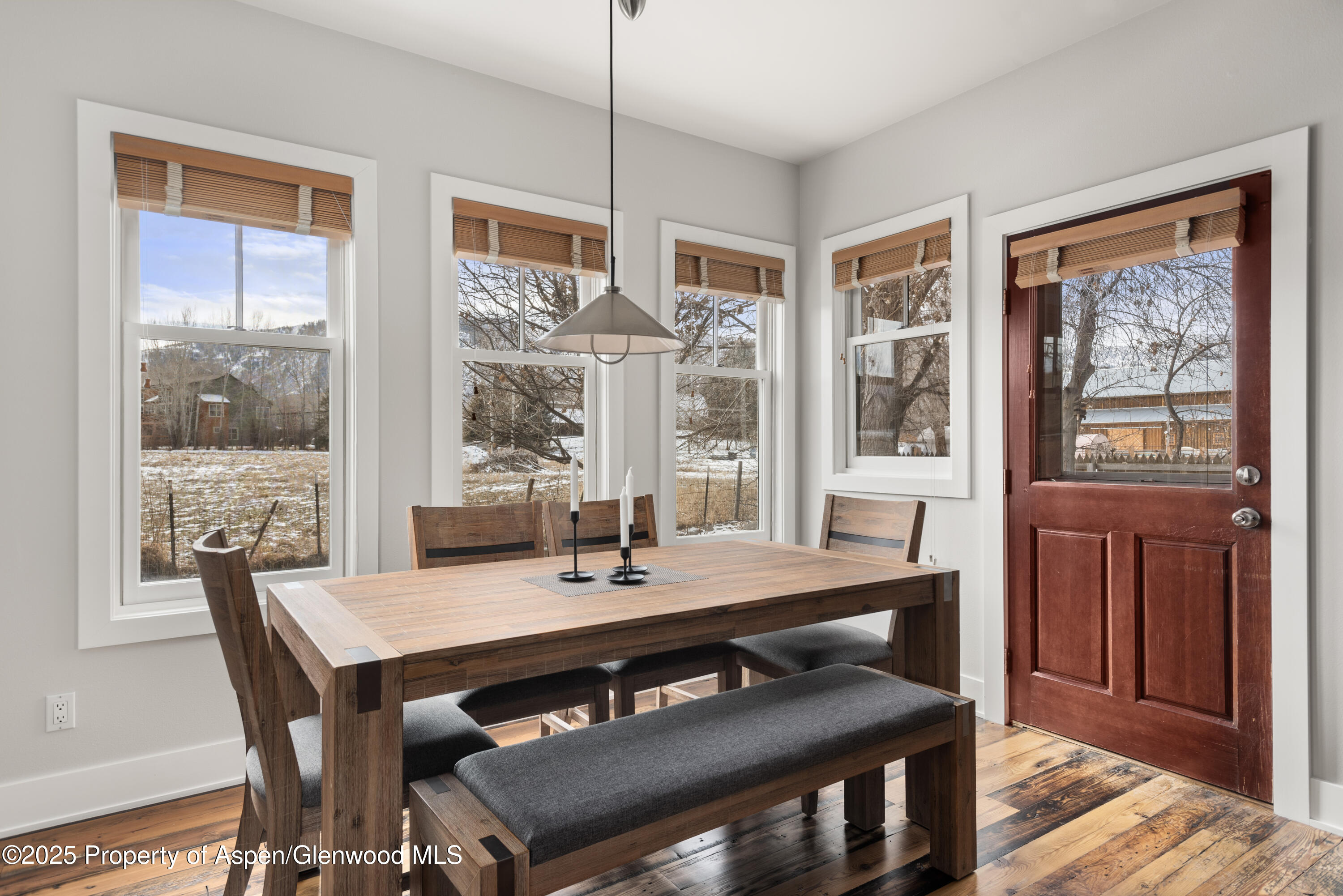 314 Sopris Circle Basalt, CO 81621 - Photo 9 of 36 a view of a dining room with furniture window and wooden floor