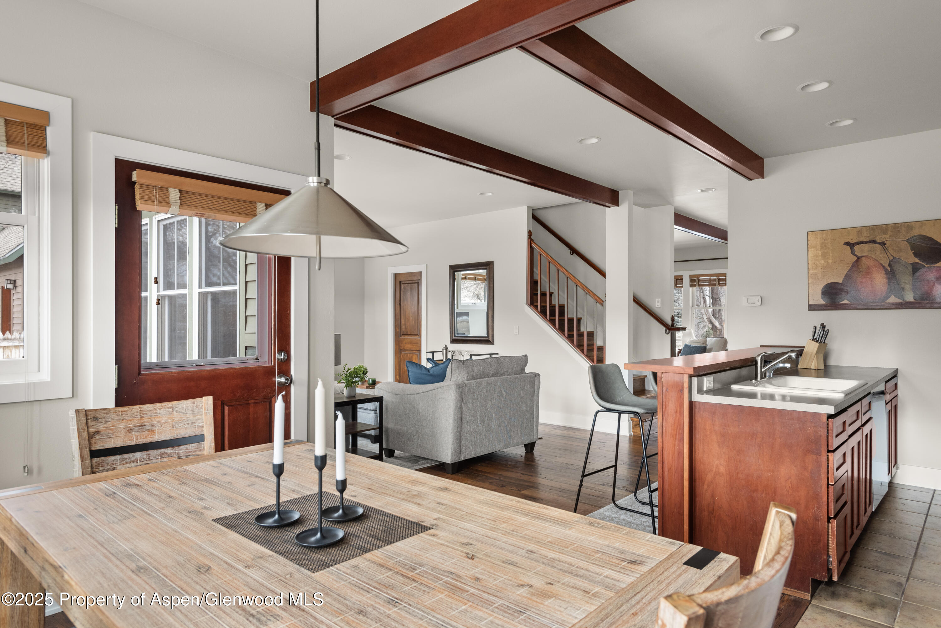 314 Sopris Circle Basalt, CO 81621 - Photo 10 of 36 a living room with furniture a wooden floor and next to a window
