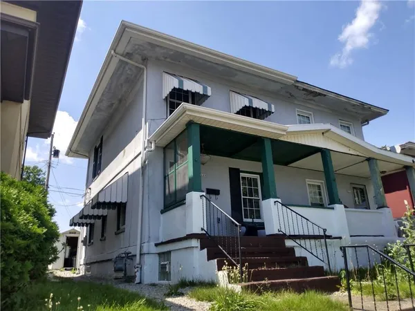 front view of house with a small yard