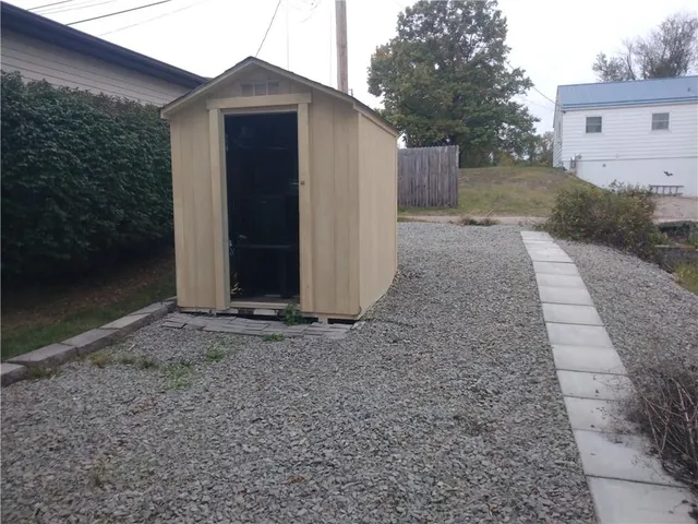 a view of a house with a yard and garage