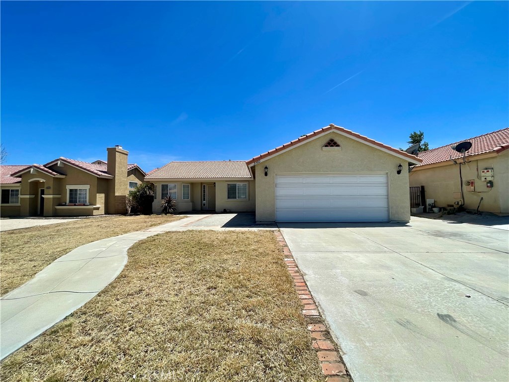 3160 Shale Road Palmdale, CA 93550 - Photo 1 of 1 a front view of a house with a yard