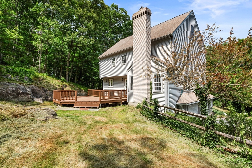 341 Quaddick Road Thompson, CT 06277 - Photo 3 of 29 a backyard of a house with table and chairs