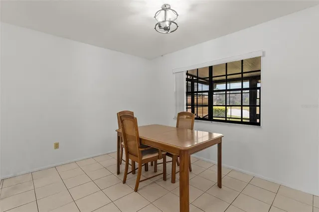 a view of a dining room with furniture and window