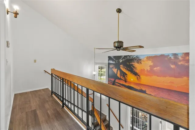 a view of a hallway with chandelier