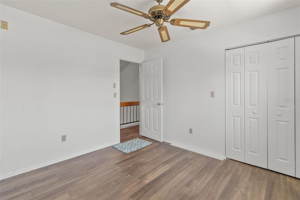 5628 Linksman Place North Port, FL 34287 - Photo 25 of 33 an empty room with wooden floor closet and windows