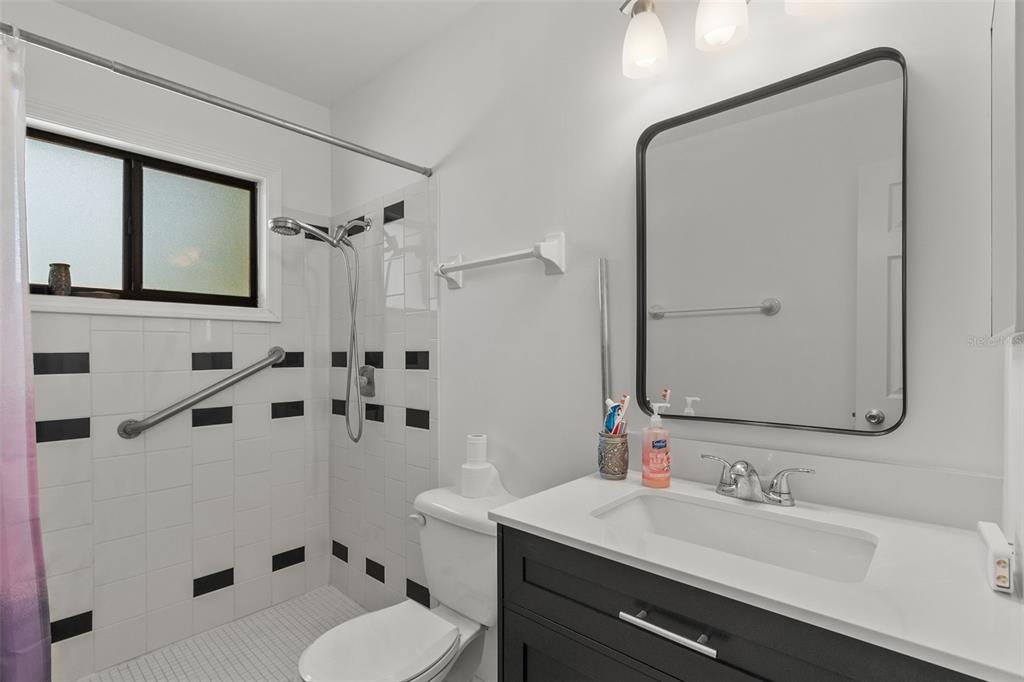 5628 Linksman Place North Port, FL 34287 - Photo 26 of 33 a bathroom with a sink toilet tub and shower