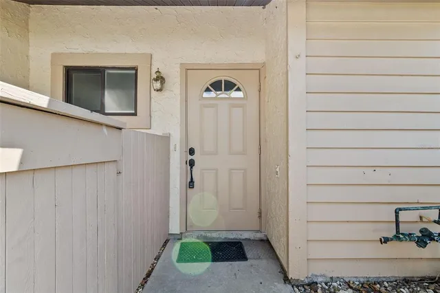 a view of a hallway to rooms