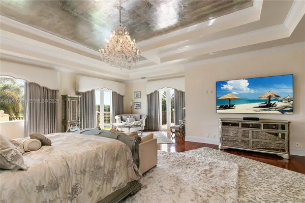 a bedroom with a bed window and couch
