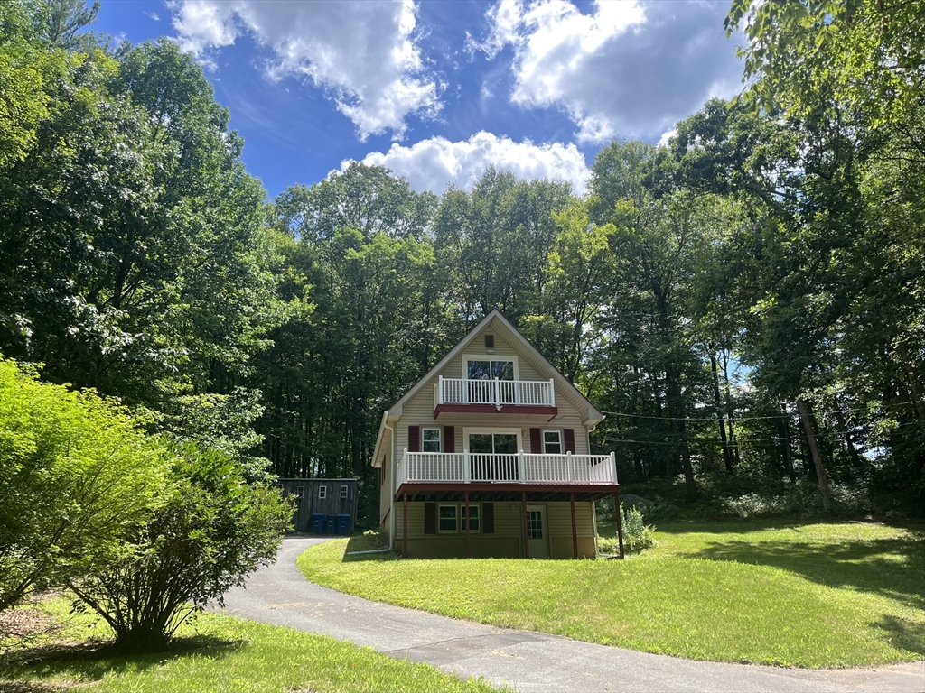 196 Munn Road Monson, MA 01057 - Photo 1 of 16 a house with trees in the background