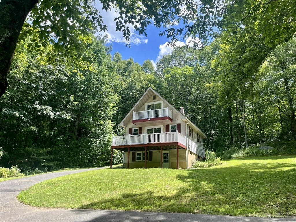 196 Munn Road Monson, MA 01057 - Photo 14 of 16 a house view with a garden and trees