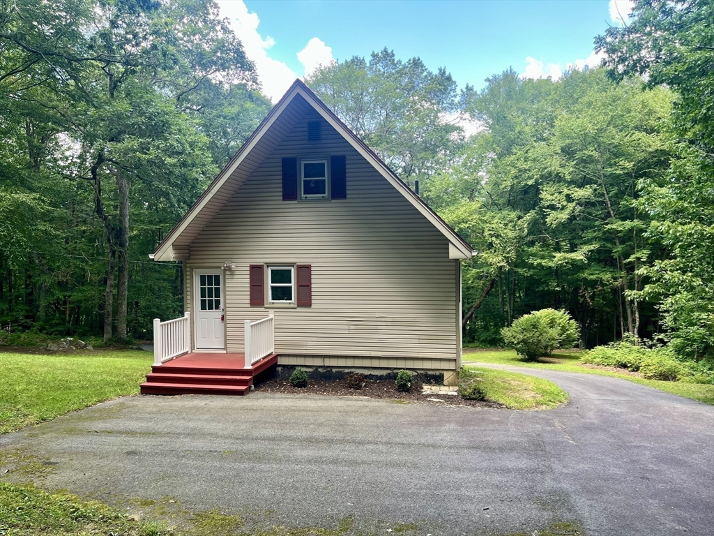 196 Munn Road Monson, MA 01057 - Photo 15 of 16 a view of backyard of house with yard and outdoor seating
