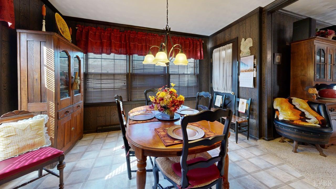 426 Burgess Road Madison Heights, VA 24572 - Photo 12 of 51 a dining room view with furniture and chandelier