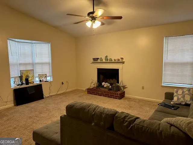 a bedroom with a bed and a fireplace