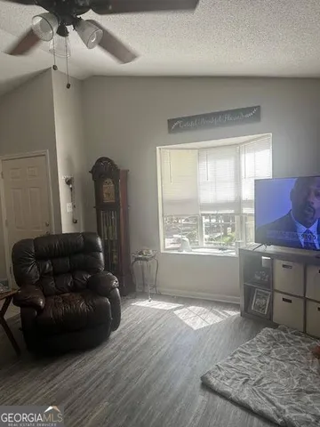 a living room with furniture and a window