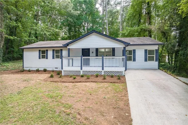 a house with trees in the background