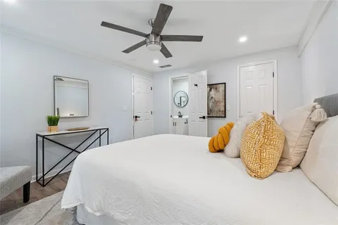 a bedroom with a bed a desk and chair