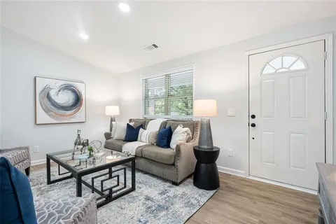 a living room with furniture and a window