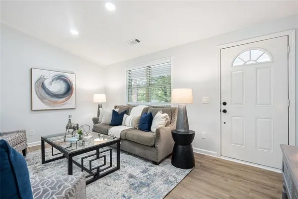 a living room with furniture and a window