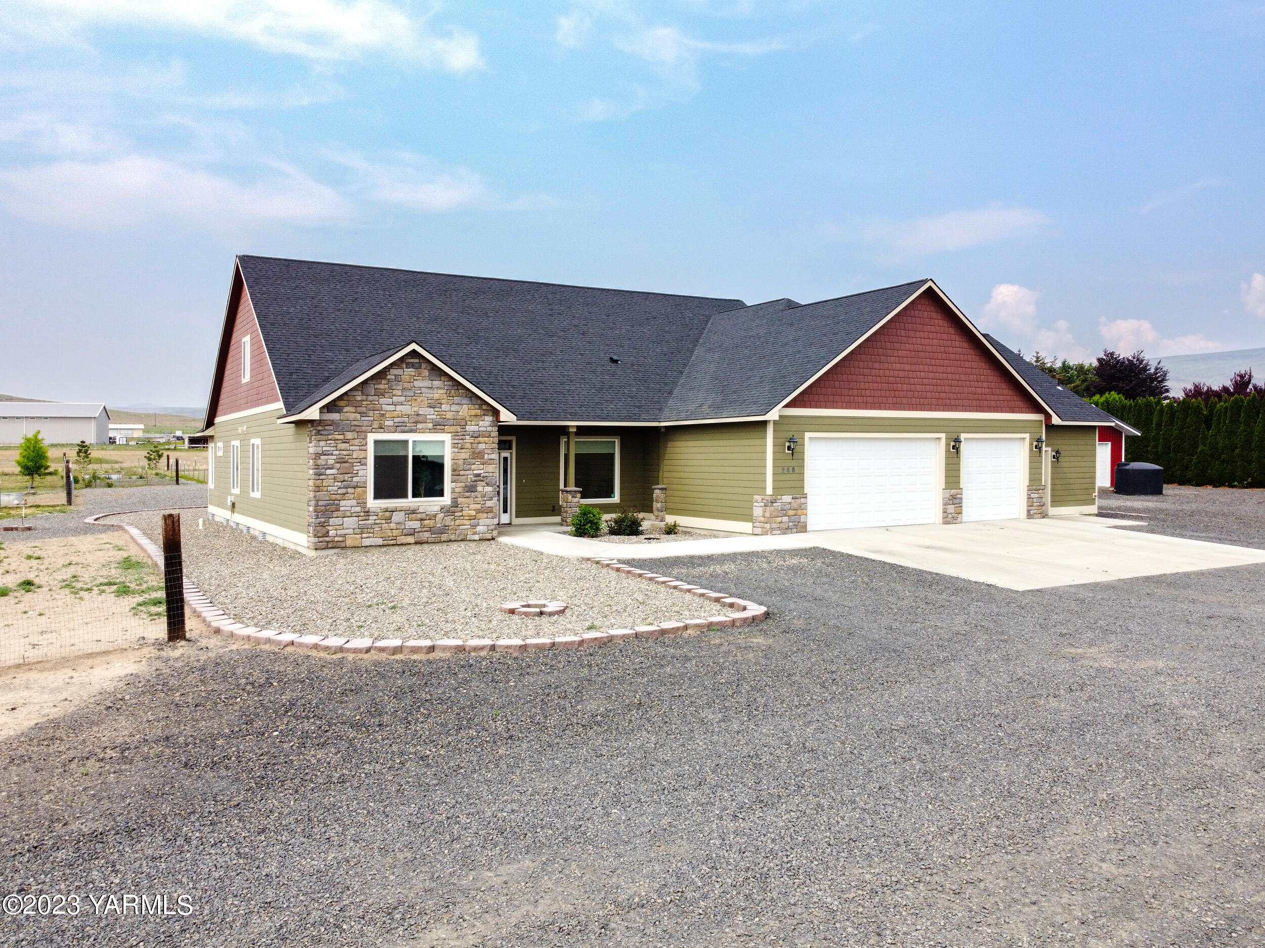 245 West Huntzinger Road Selah, WA 98942 - Photo 2 of 54 a front view of a house with a yard
