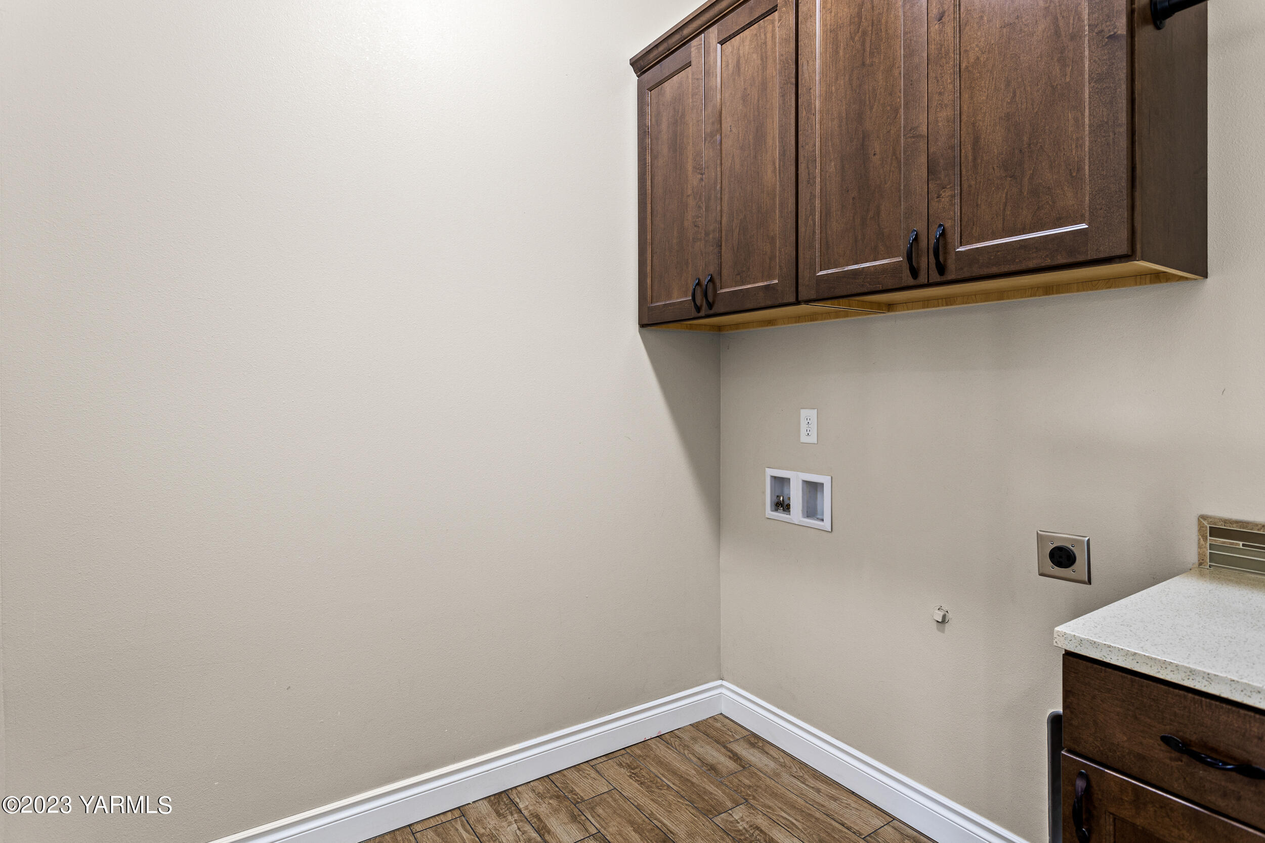245 West Huntzinger Road Selah, WA 98942 - Photo 23 of 54 a view of storage and utility room with racks on the wall