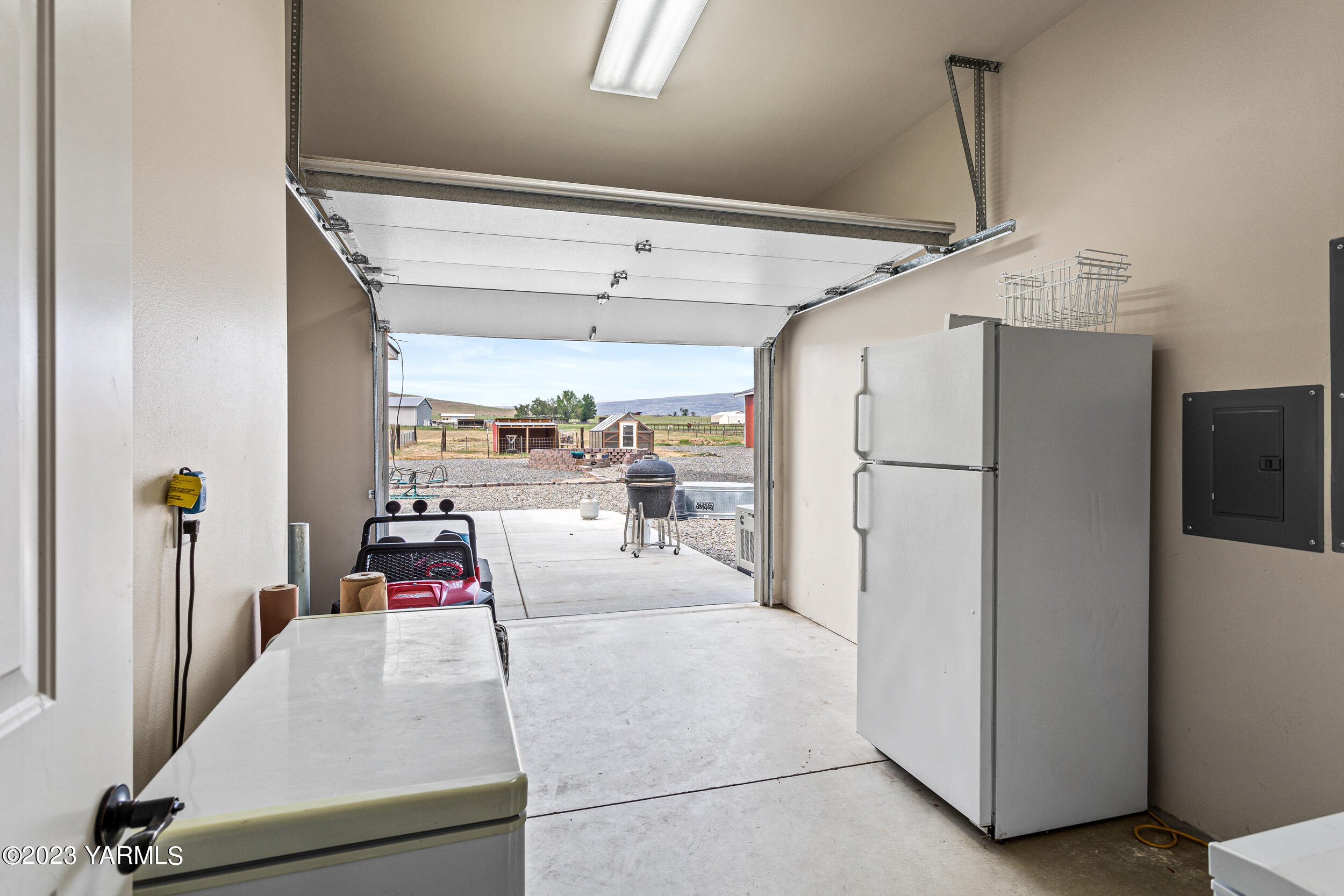 245 West Huntzinger Road Selah, WA 98942 - Photo 25 of 54 a view of a kitchen with fridge and workspace