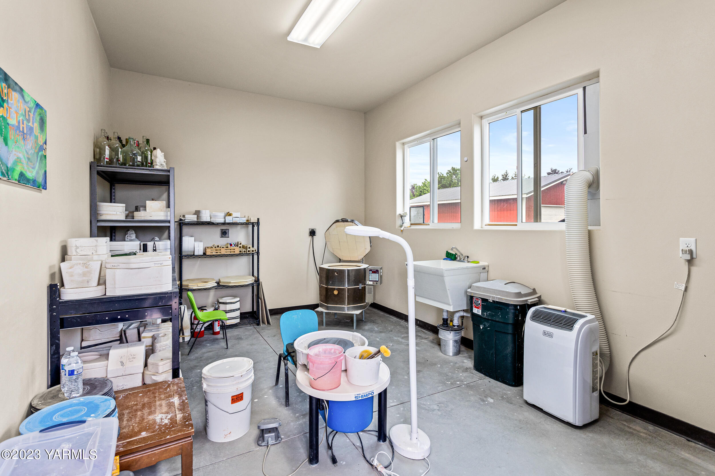 245 West Huntzinger Road Selah, WA 98942 - Photo 27 of 54 a living room with furniture a piano and a window