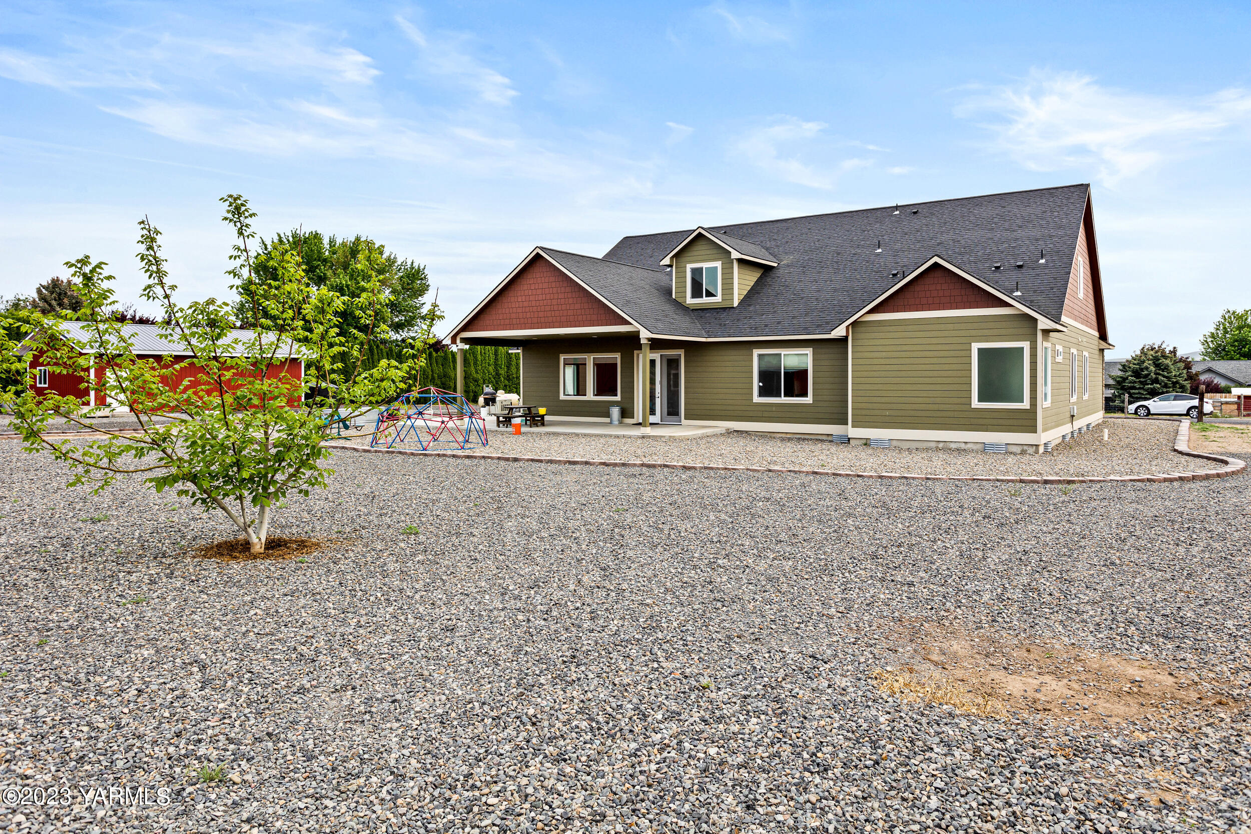245 West Huntzinger Road Selah, WA 98942 - Photo 33 of 54 a front view of a house with a yard and garage