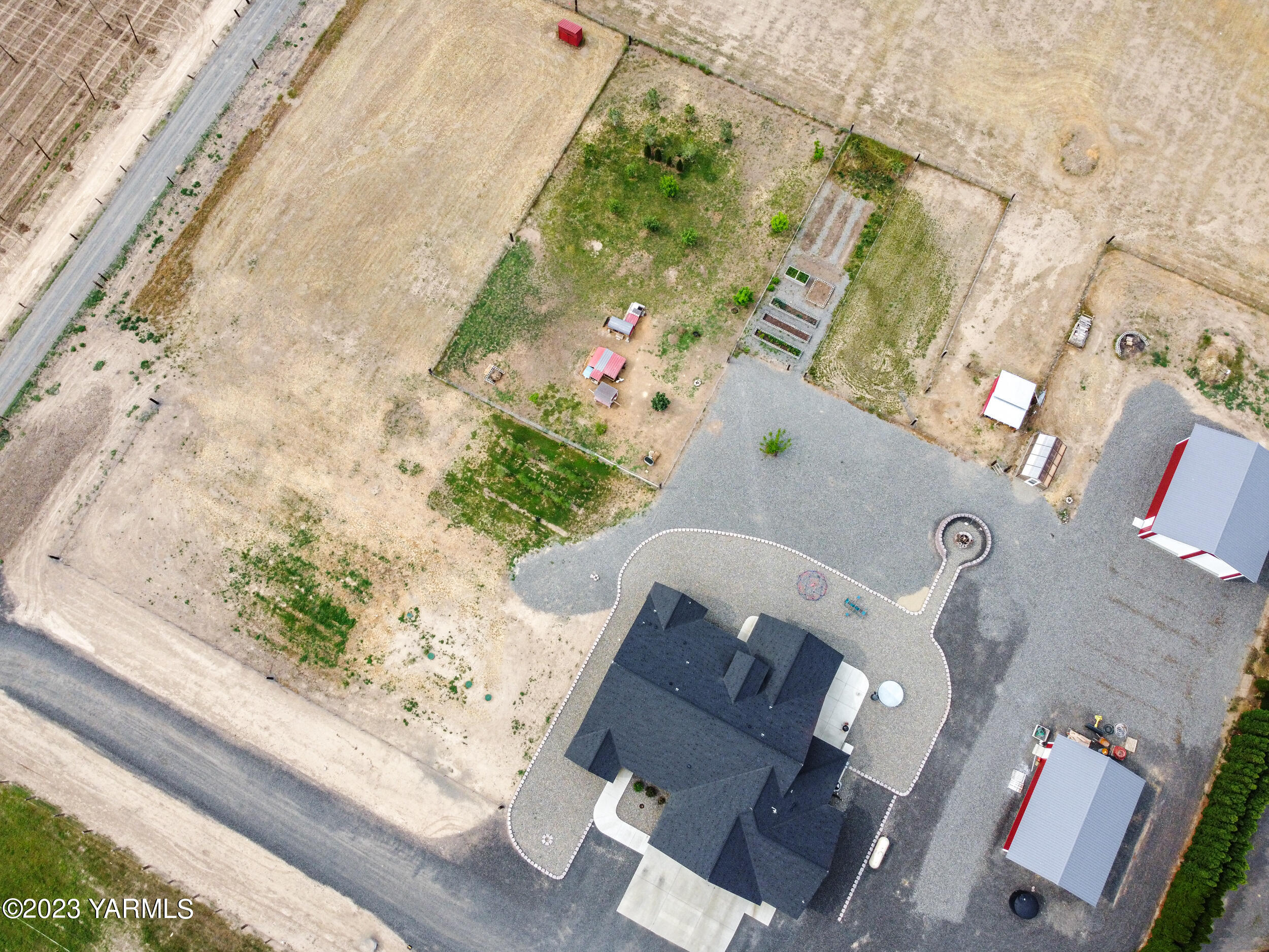 245 West Huntzinger Road Selah, WA 98942 - Photo 46 of 54 an aerial view of a house with a yard and wooden floor