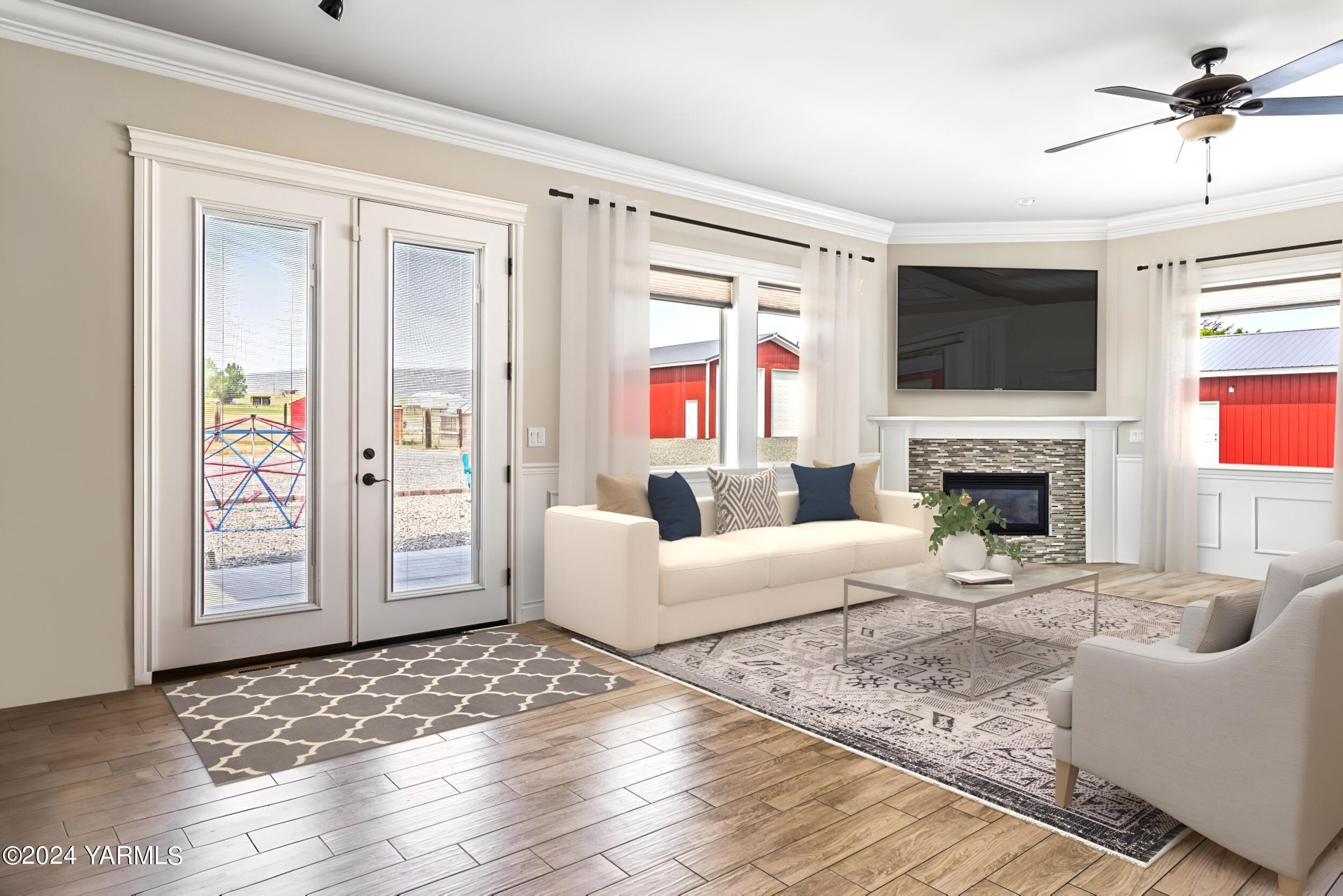 245 West Huntzinger Road Selah, WA 98942 - Photo 5 of 54 a living room with furniture a flat screen tv and a fireplace